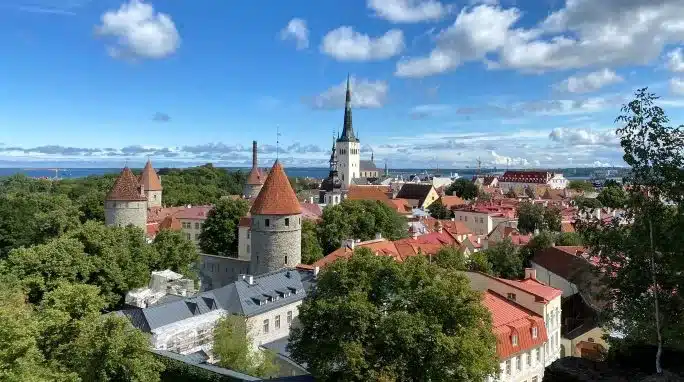 View of the old city of Tallinn, Estonia, from Kohtuotsa viewing platform on a sunny summer day.